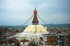 
Our only organized tour in Kathmandu was to Boudhanath, the largest stupa in Nepal and estimated to be about 1400 years old. To get a better view, I walked through the side streets to a hotel on a small ridge. I politely asked if I could go to the roof for some photos and they pleasantly obliged. I sat there for a while just soaking in this wonderful scene; the size of Boudhanath struck me even more so from this higher farther vantage point.
